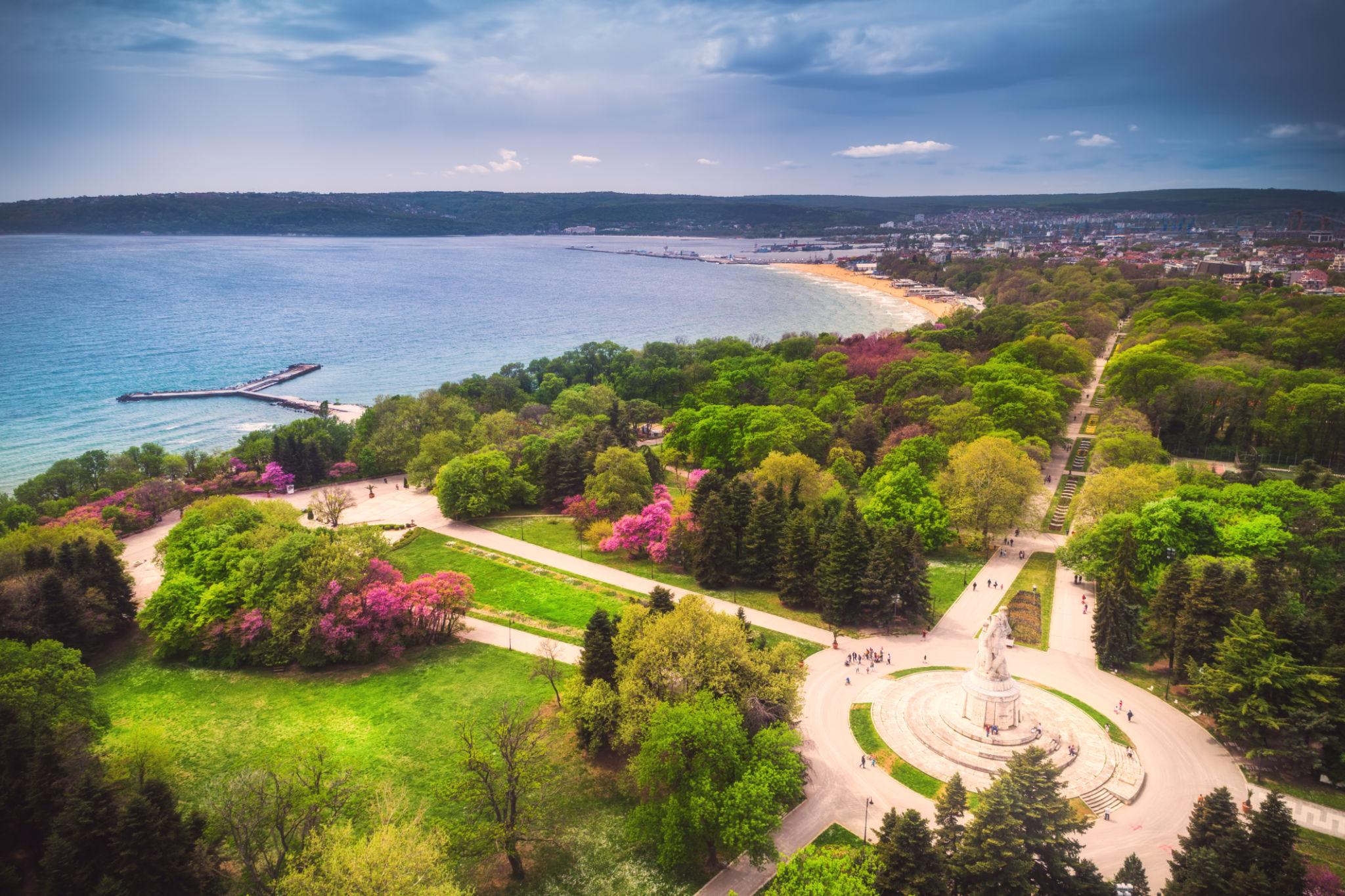 The Sea Garden of Varna in spring — paths, fountain, and Black Sea beyond